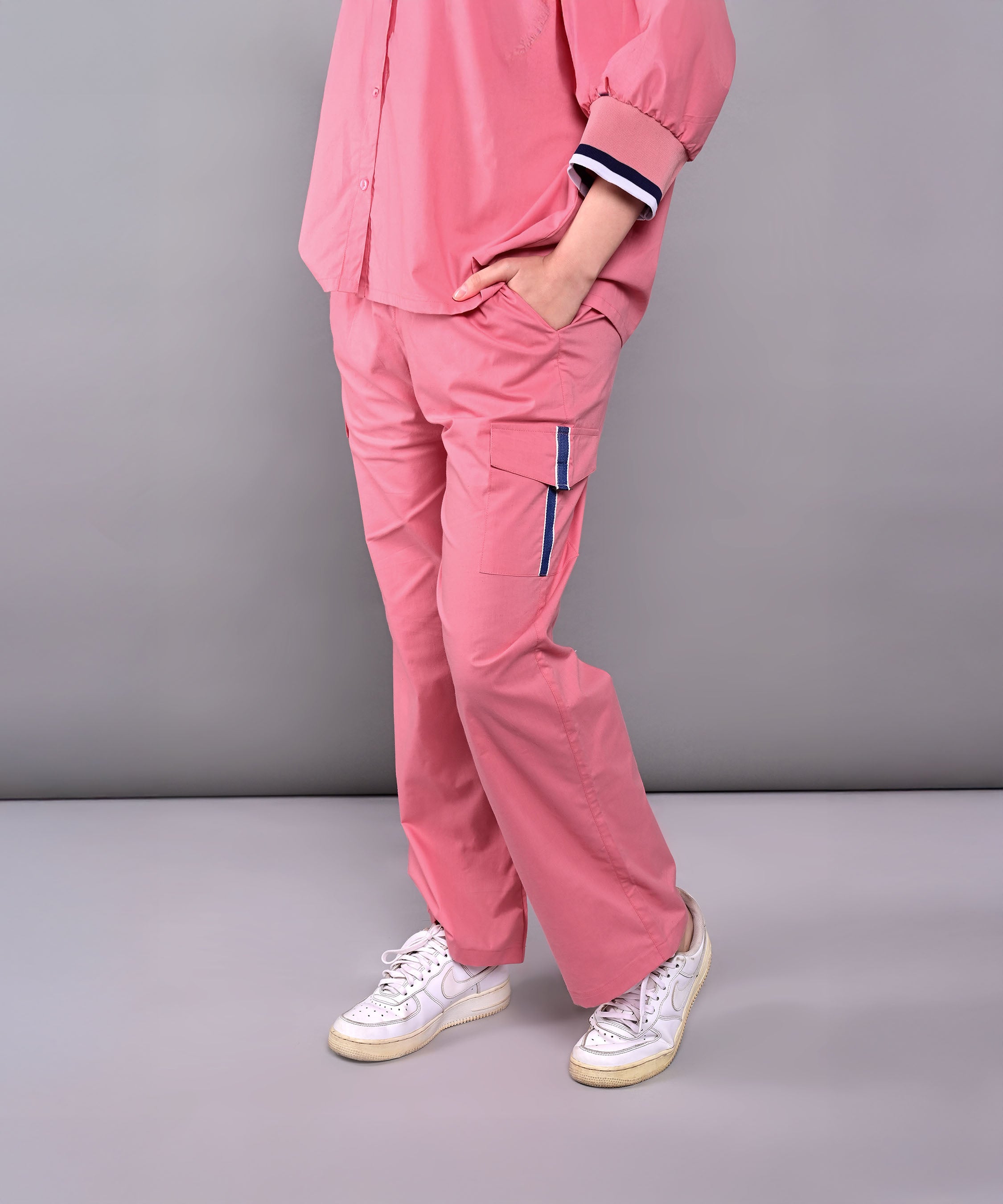 Person wearing the Effortlessly Chic Set, styled with white sneakers, standing against a plain grey background.