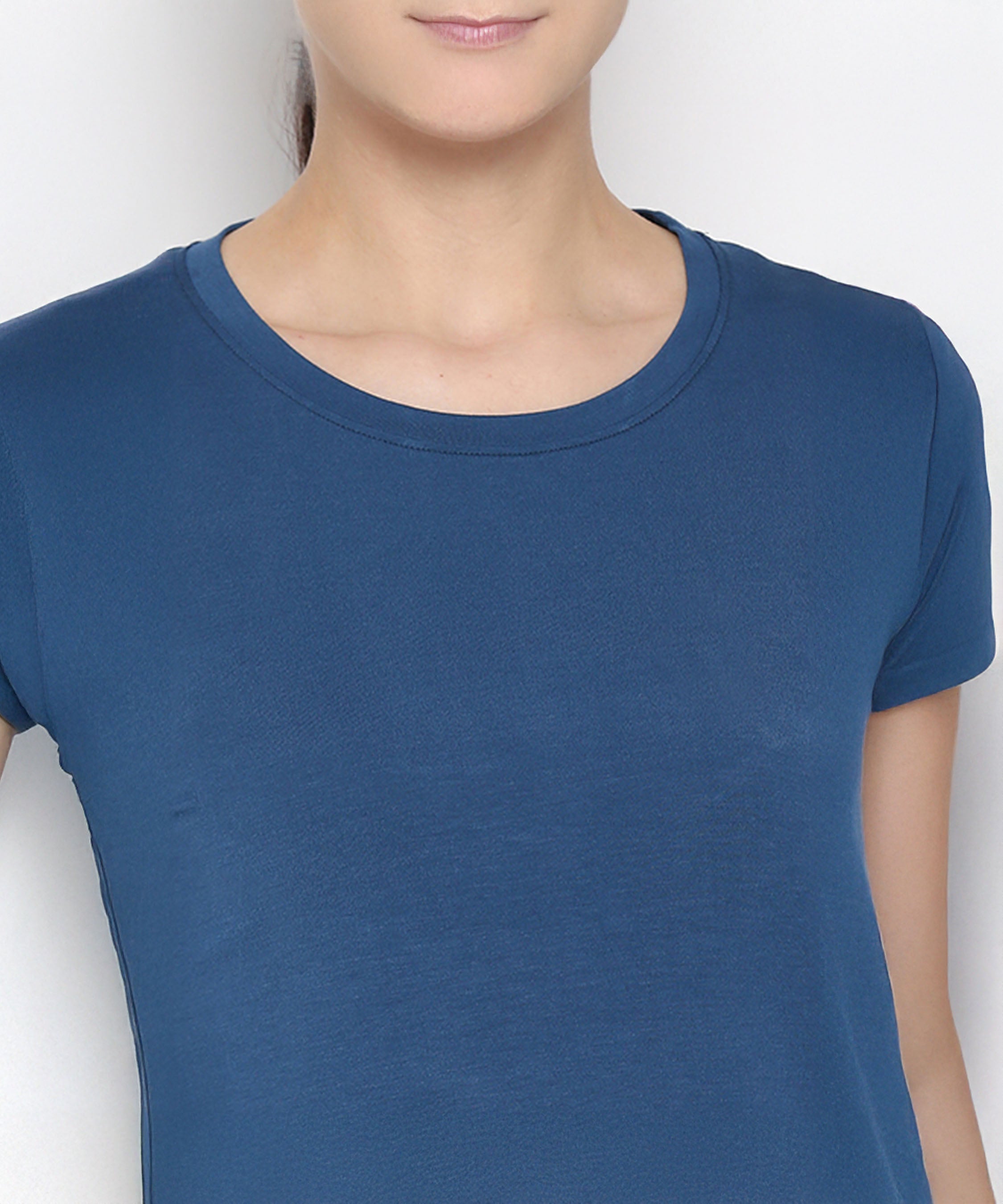 A person wearing the Atlantic Blue Active Duo crew-neck t-shirt, made from soft cotton modal, is shown from shoulders to chest against a plain background.
