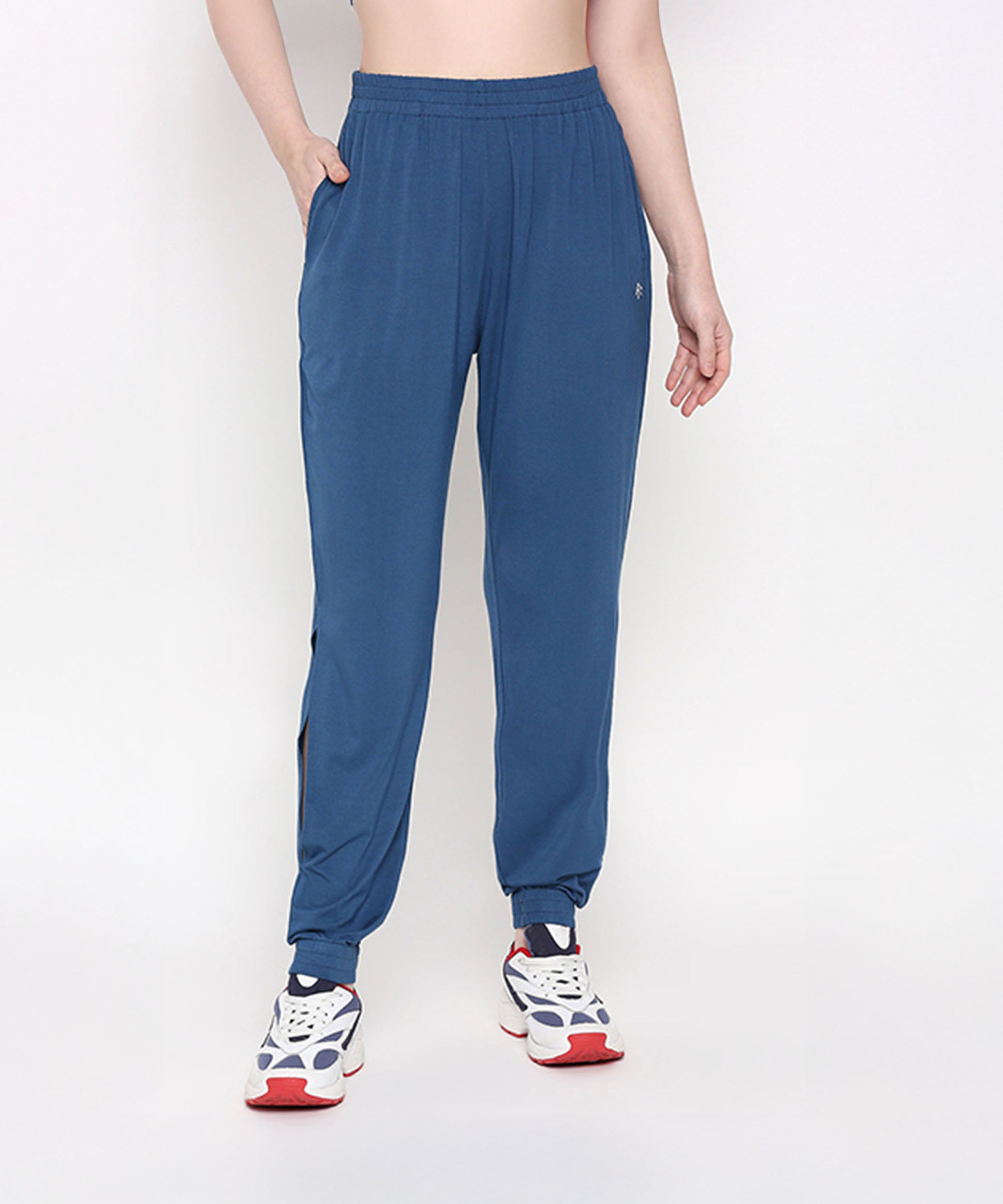 Person wearing Atlantic Blue Active Duo joggers and white sneakers, standing against a plain light background.