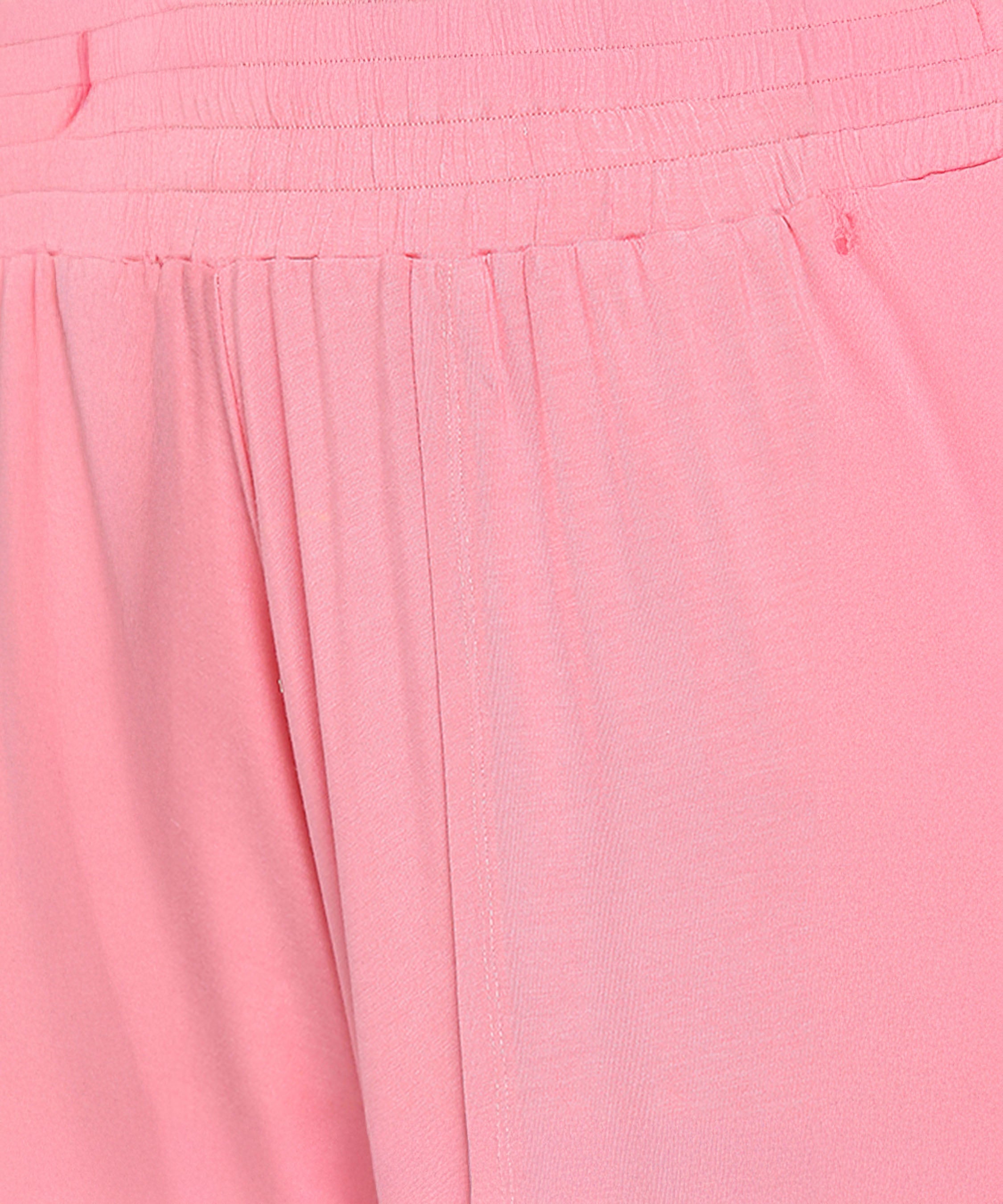 Close-up of the Coral Blissful Tulip Set in light pink, showcasing a gathered waist and smooth, flowing cotton-modal fabric.