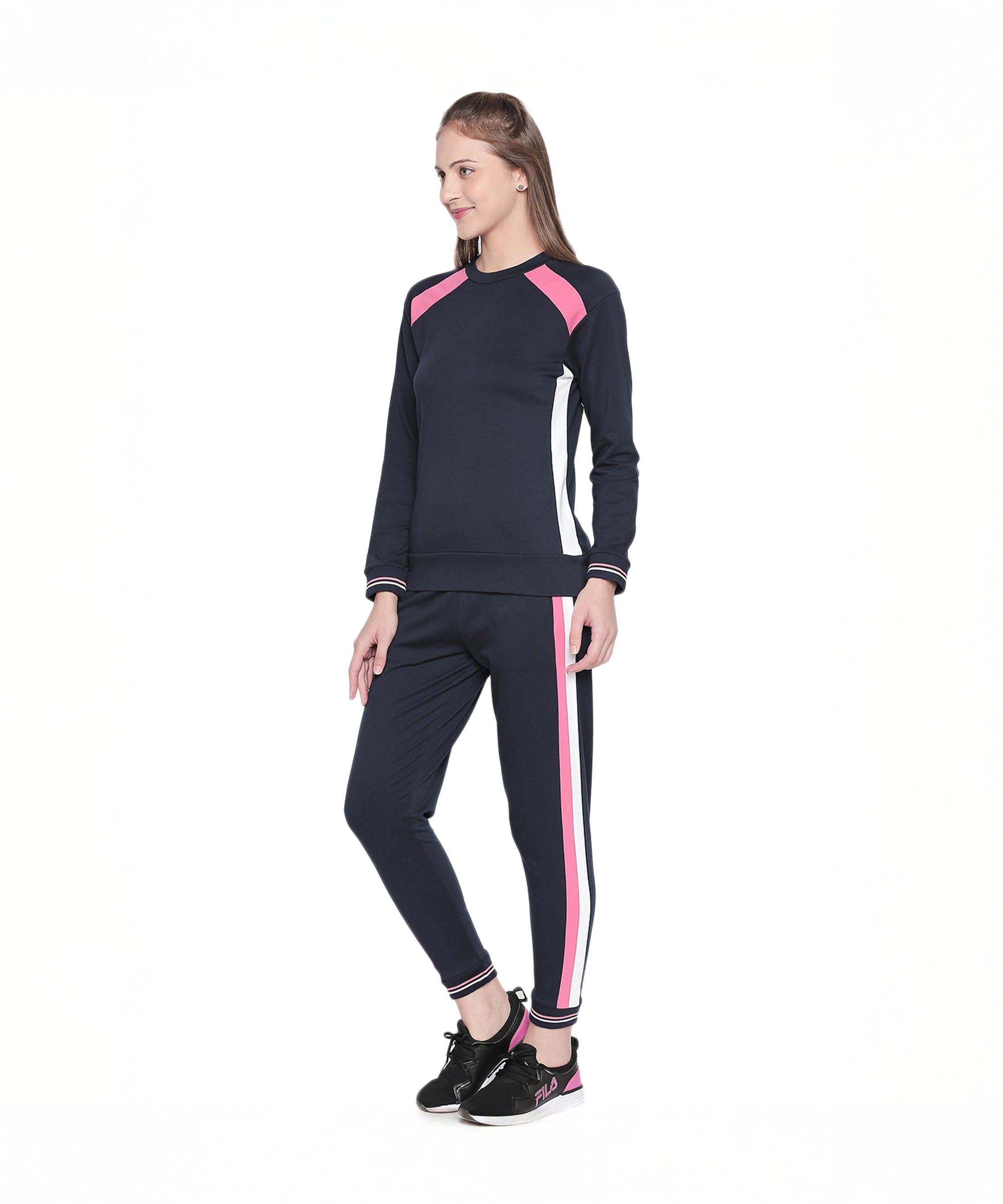 Woman wearing a Full Sleeve Navy Blue Round Neck Sweatshirt, standing and smiling against a white background.