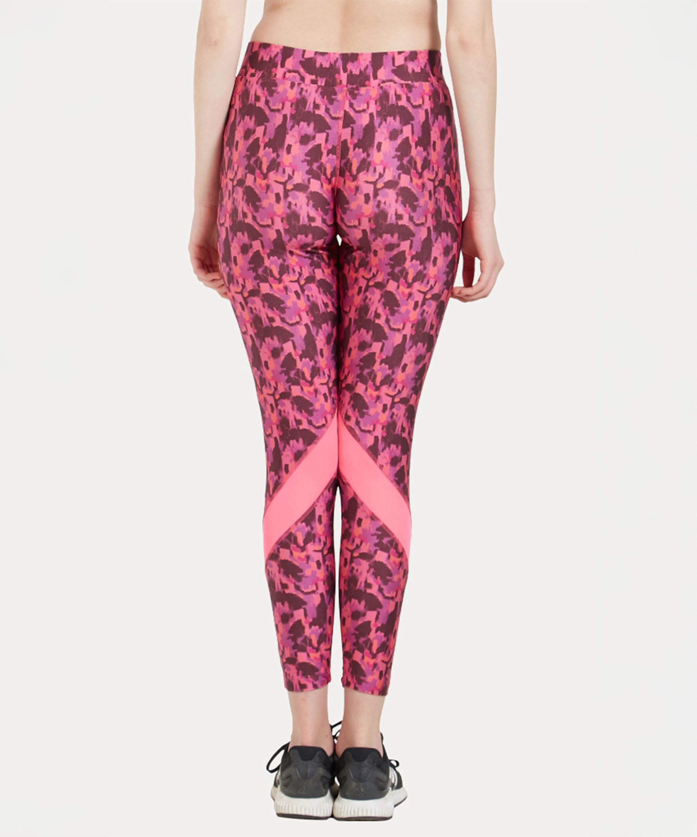 Model wears the Printed Slim Fit Track Pant LUSH with a high-rise waistband and black sneakers, shown from the back against a white background.