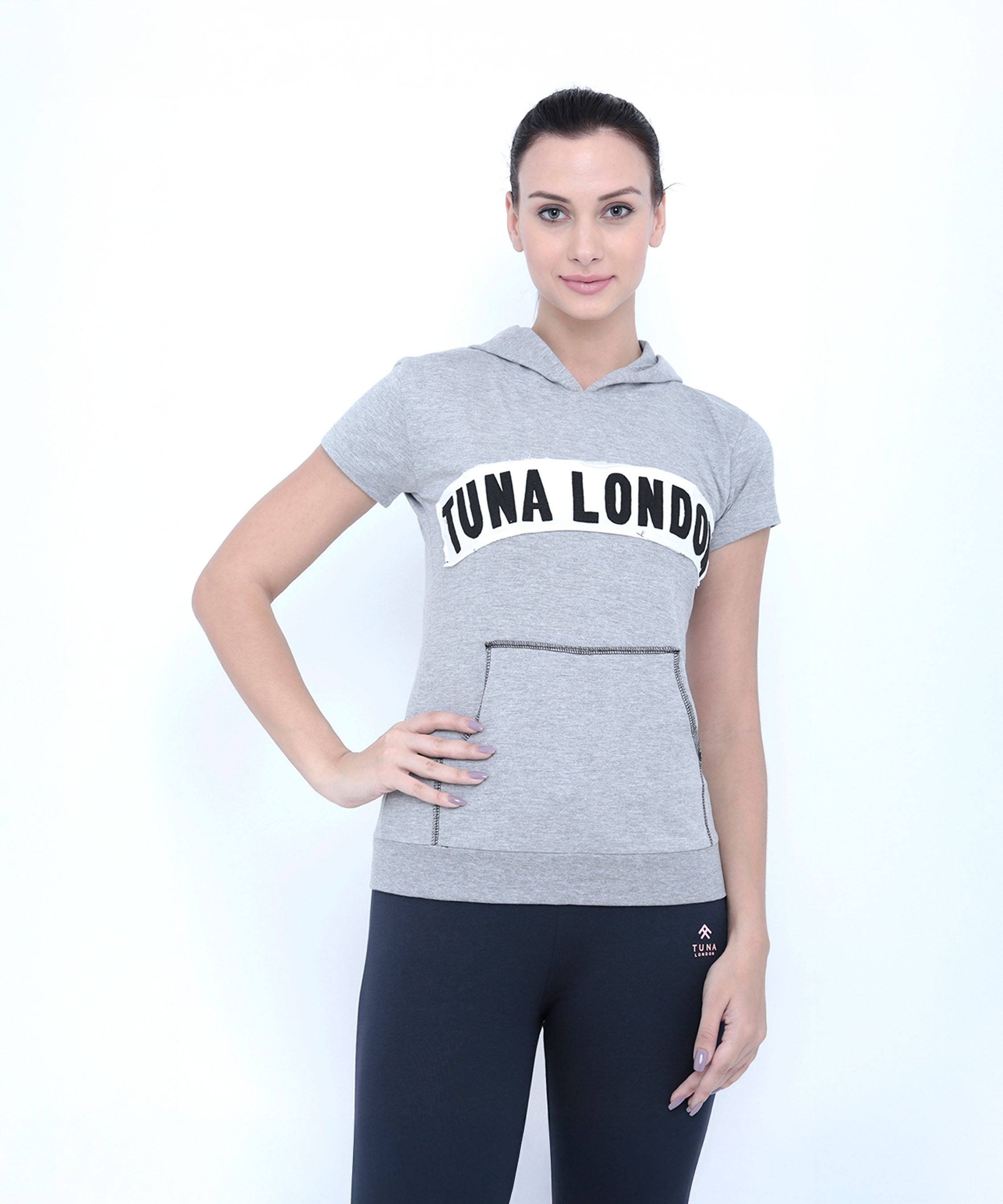Active women will love this look: a Grey Hoodie with "TUNA LONDON" text pairs perfectly with black leggings, offering sporty style and cotton comfort.