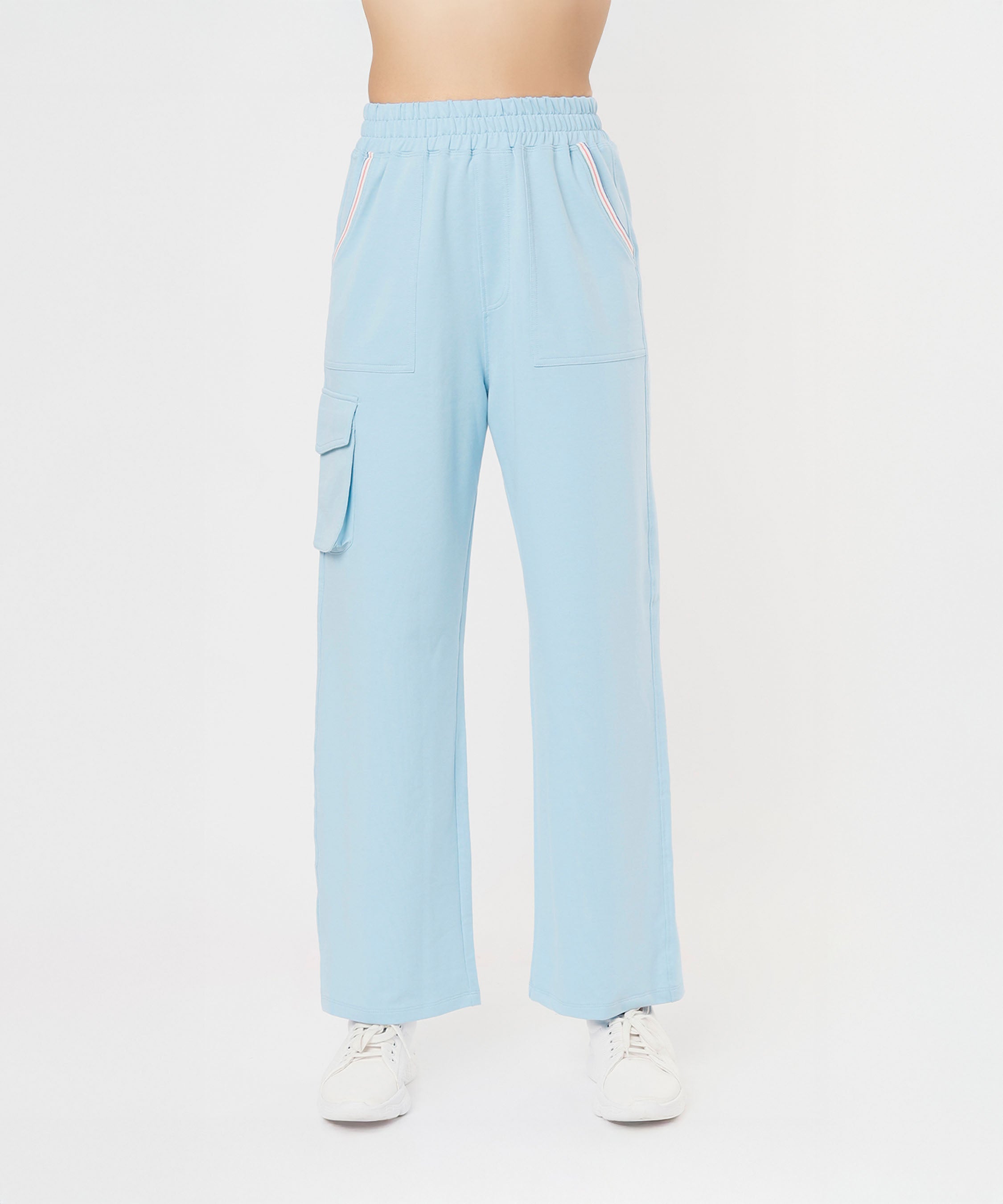 Person wearing light blue cargo pants, the Blue Dream Crop Top, and white sneakers, standing against a plain white background.