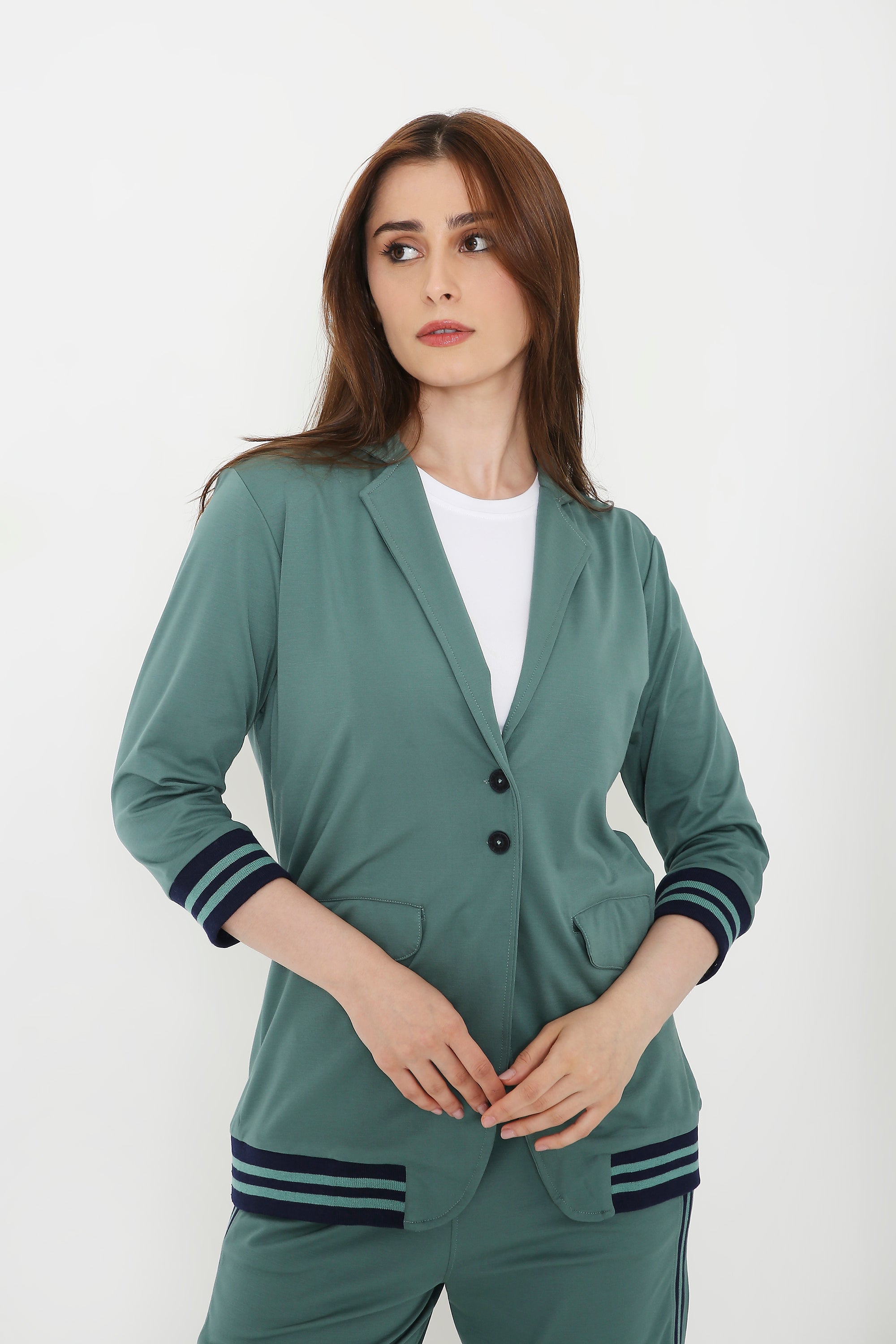 Woman wearing the Sage Green Athleisure Blazer Jacket and Track Set with striped cuffs and hem, standing against a plain white background.