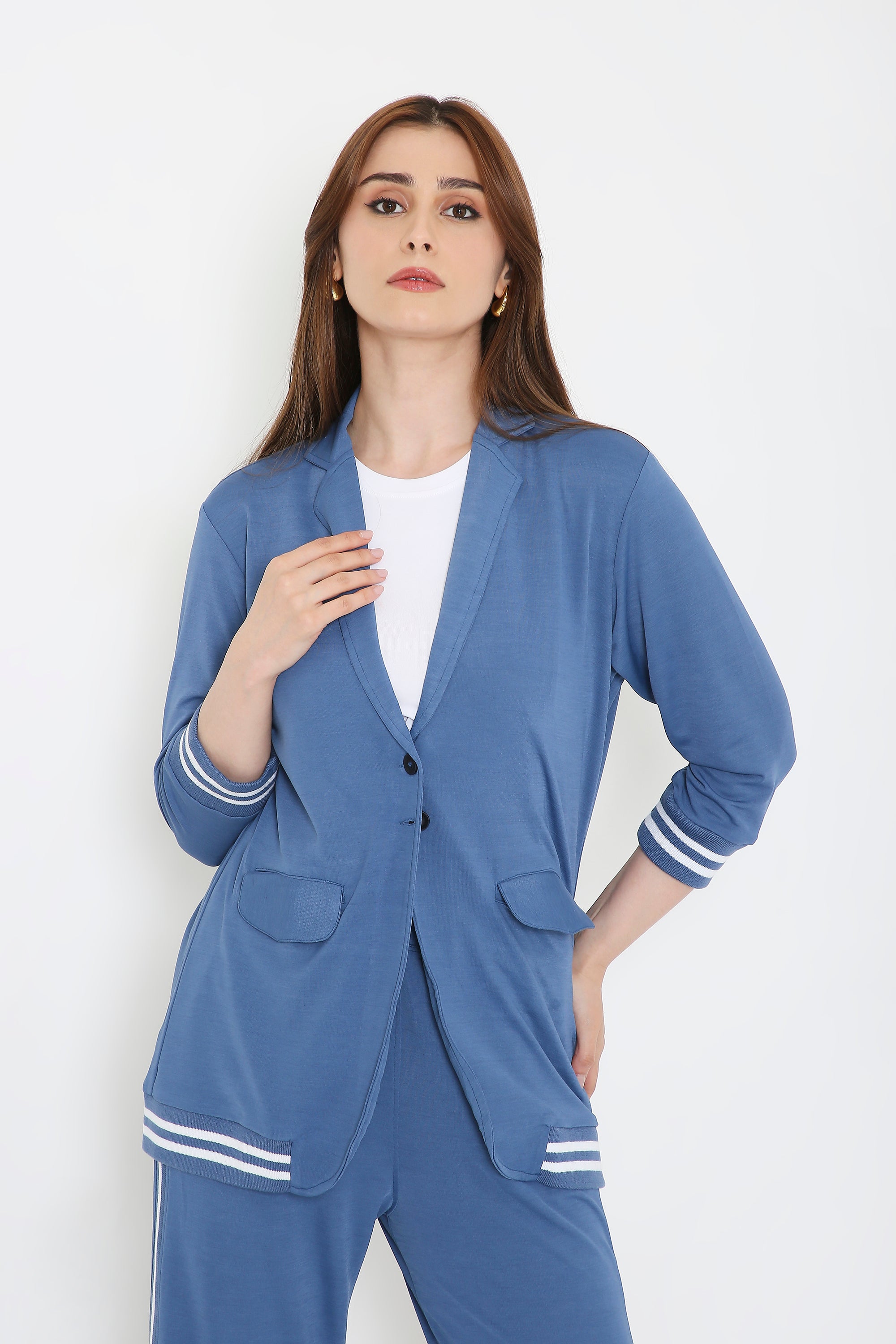 Woman in the Atlantic Blue Athleisure Blazer Jacket and Track Set with white stripes, posing confidently against a plain white background.