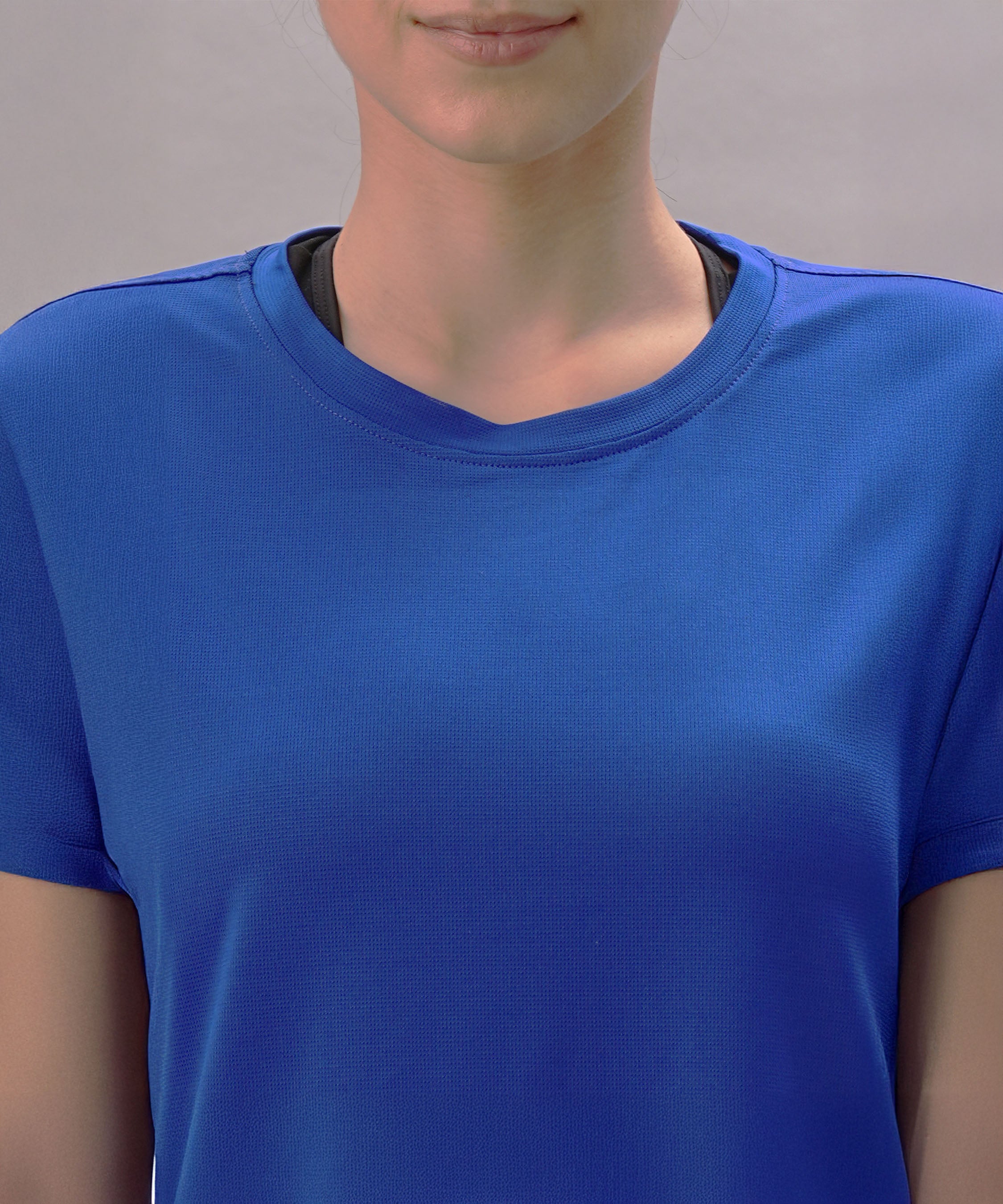 Person wearing the Blue Comfort T-Shirt, shown from shoulders to chin against a plain background.
