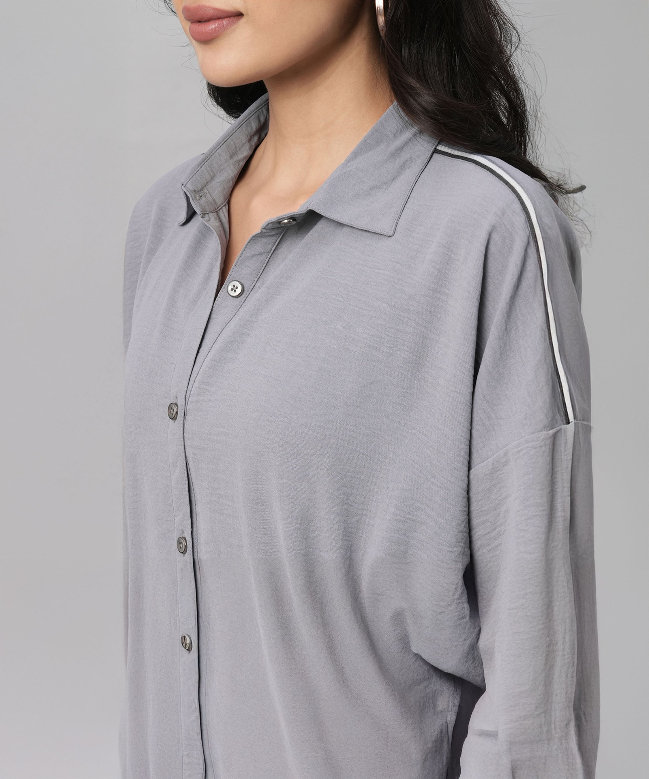 Woman wearing a Grey Tie Up Top with Loose Pants Cord Set featuring light gray fabric and a white-striped shoulder detail.