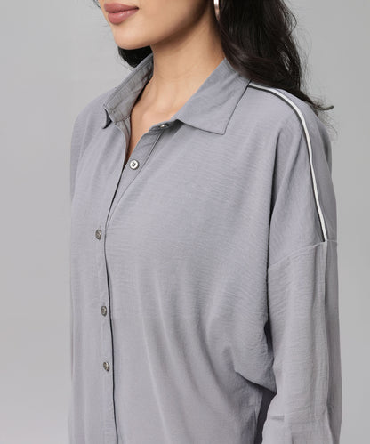 Woman wearing a Grey Tie Up Top with Loose Pants Cord Set featuring light gray fabric and a white-striped shoulder detail.
