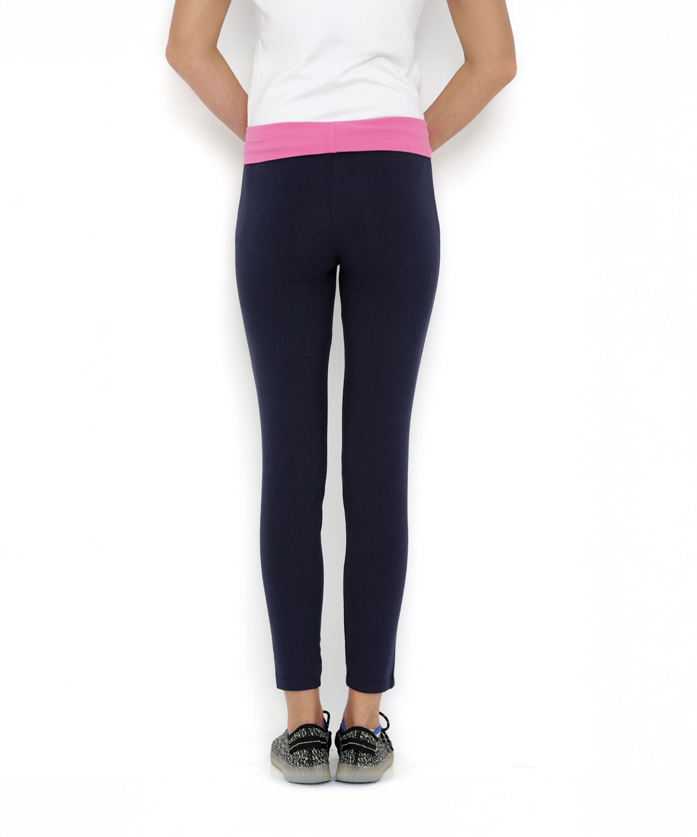 A person is wearing Tuna London Solid Women's Blue Track Pants, standing against a white background.