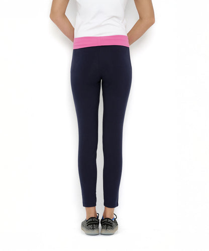 A person is wearing Tuna London Solid Women's Blue Track Pants, standing against a white background.