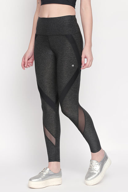 Person wearing Grey High Waisted Sports Leggings LG14 and silver platform sneakers, highlighting workout comfort against a plain background.