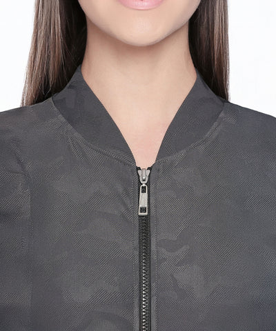 Close-up of a woman wearing an Active Wear Printed Jacket in Grey.