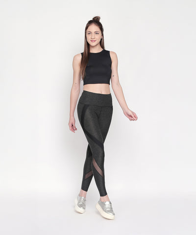 Woman in black crop top and Grey High Waisted Sports Leggings LG14 poses against a plain white background, wearing silver sneakers.