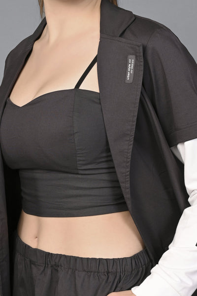 A woman models the Athleisure Blazer Tracks Two Piece Co-ord set, featuring a black crop top and pants, styled against a gray background.