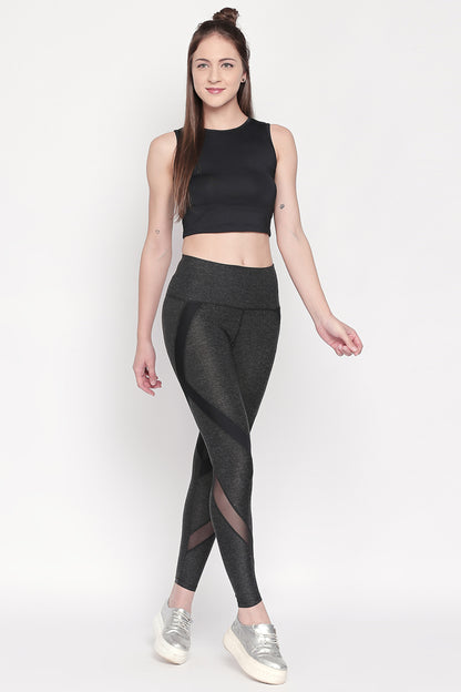 Woman in black crop top and Grey High Waisted Sports Leggings LG14, wearing silver sneakers, standing and smiling in workout comfort.