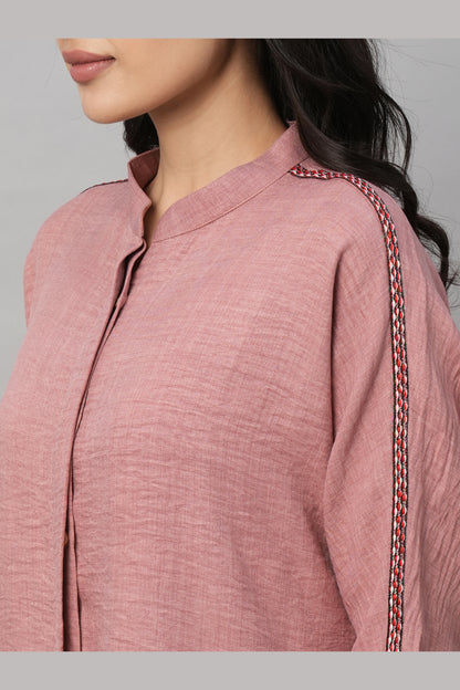 Model wears the Vintage Pink Loose Shirt and Tie Up Pant Cord Set in 100% cotton, featuring a textured loose shirt with embroidered shoulder detail and matching tie-up pants, shown from the side.