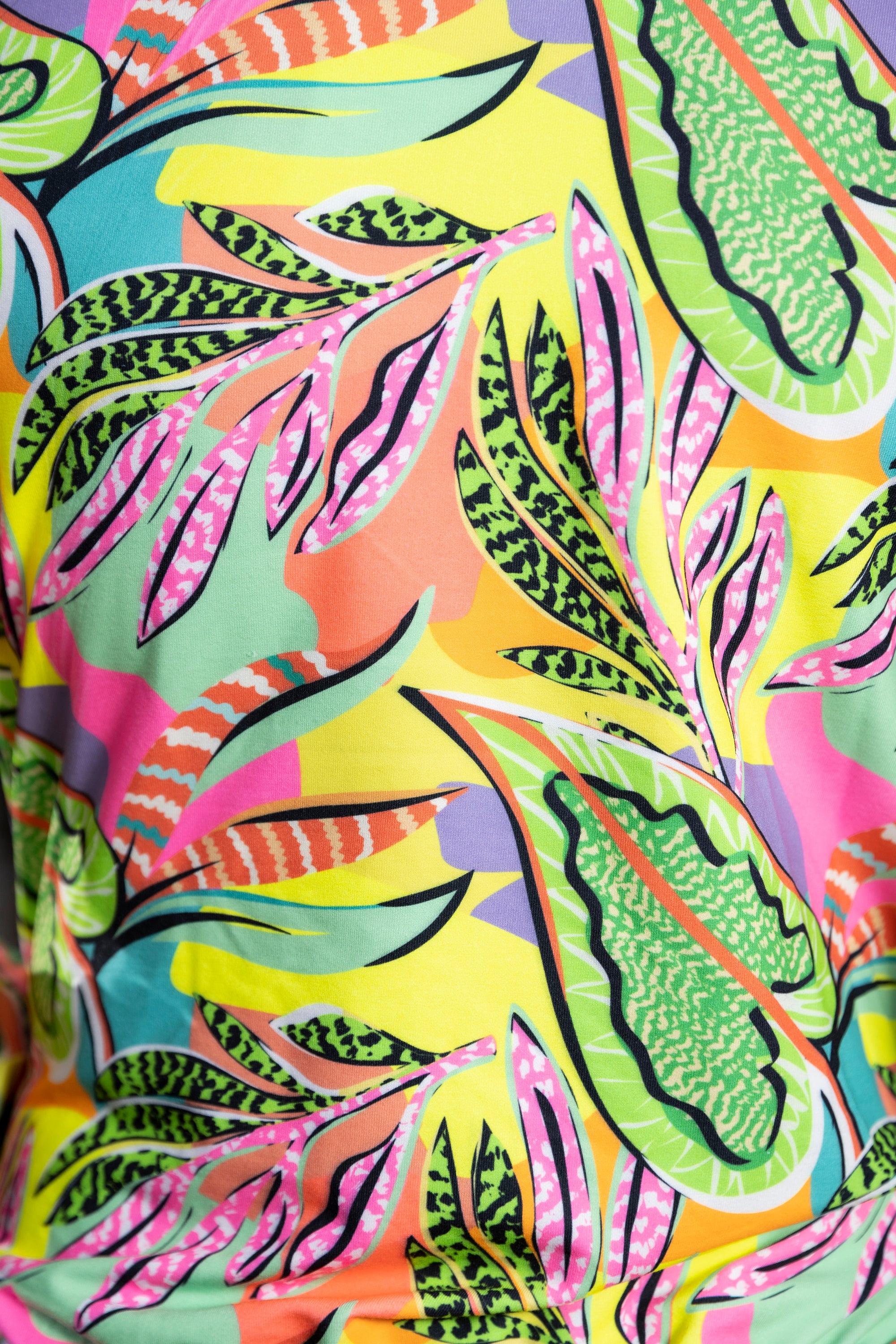 Close-up of Neon colour Printed Jacket made with skin-friendly polyblended fabric, showcasing vibrant tropical leaf patterns in green, pink, orange, and yellow tones.