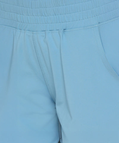 Close-up of Tuna Active Blue Joggers showcasing an elastic waist, visible pockets, and detailed stitching for a comfortable fit.