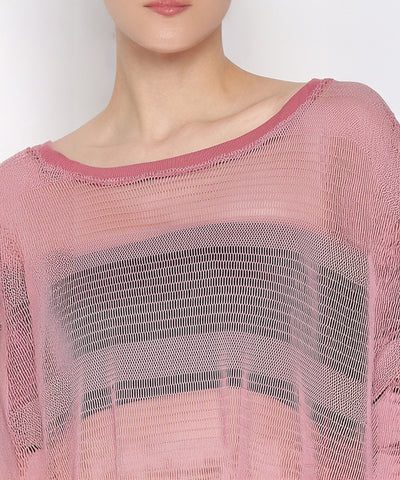 Wearing the Pink Netted Top with a wide neckline and sheer pink knit design, paired with stylish leggings and visible black stripes underneath, creates a sporty and fashionable look.