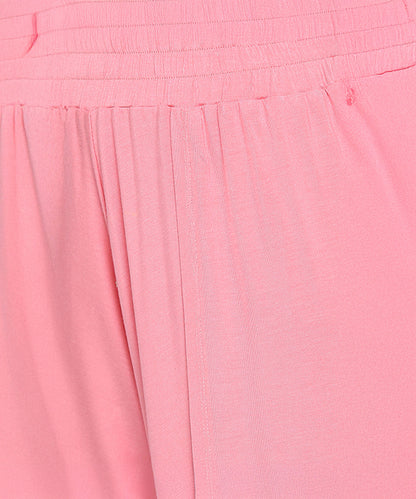 Close-up of the Coral Blissful Tulip Set in light pink, showcasing a gathered waist and smooth, flowing cotton-modal fabric.