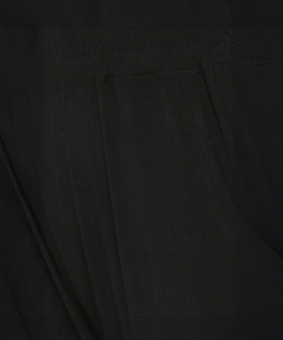 Close-up of buttery soft fabric with visible stitching and a seam, likely from the Versatile Black Ensemble.