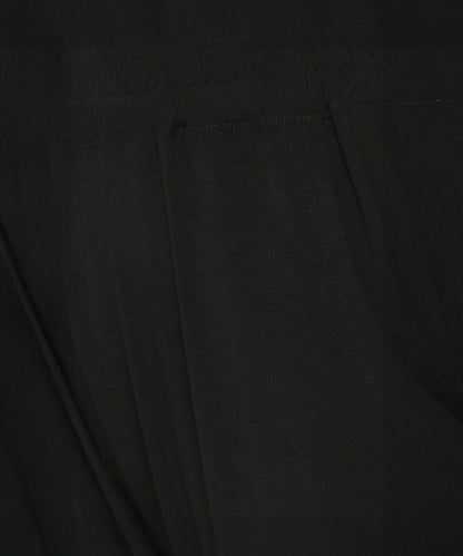 Close-up of buttery soft fabric with visible stitching and a seam, likely from the Versatile Black Ensemble.