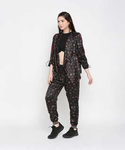 Woman in a black crop top and Tuna Active Butterfly Joggers, standing against a white background.