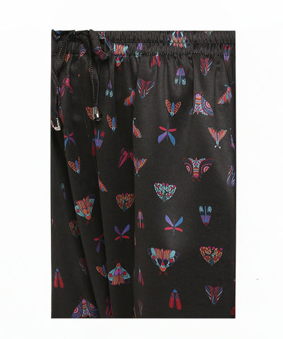 Tuna Active Butterfly Joggers: Black satin joggers with vibrant moth and butterfly prints, finished with a drawstring waistband—add a bold statement to your style with these unique, eye-catching joggers.