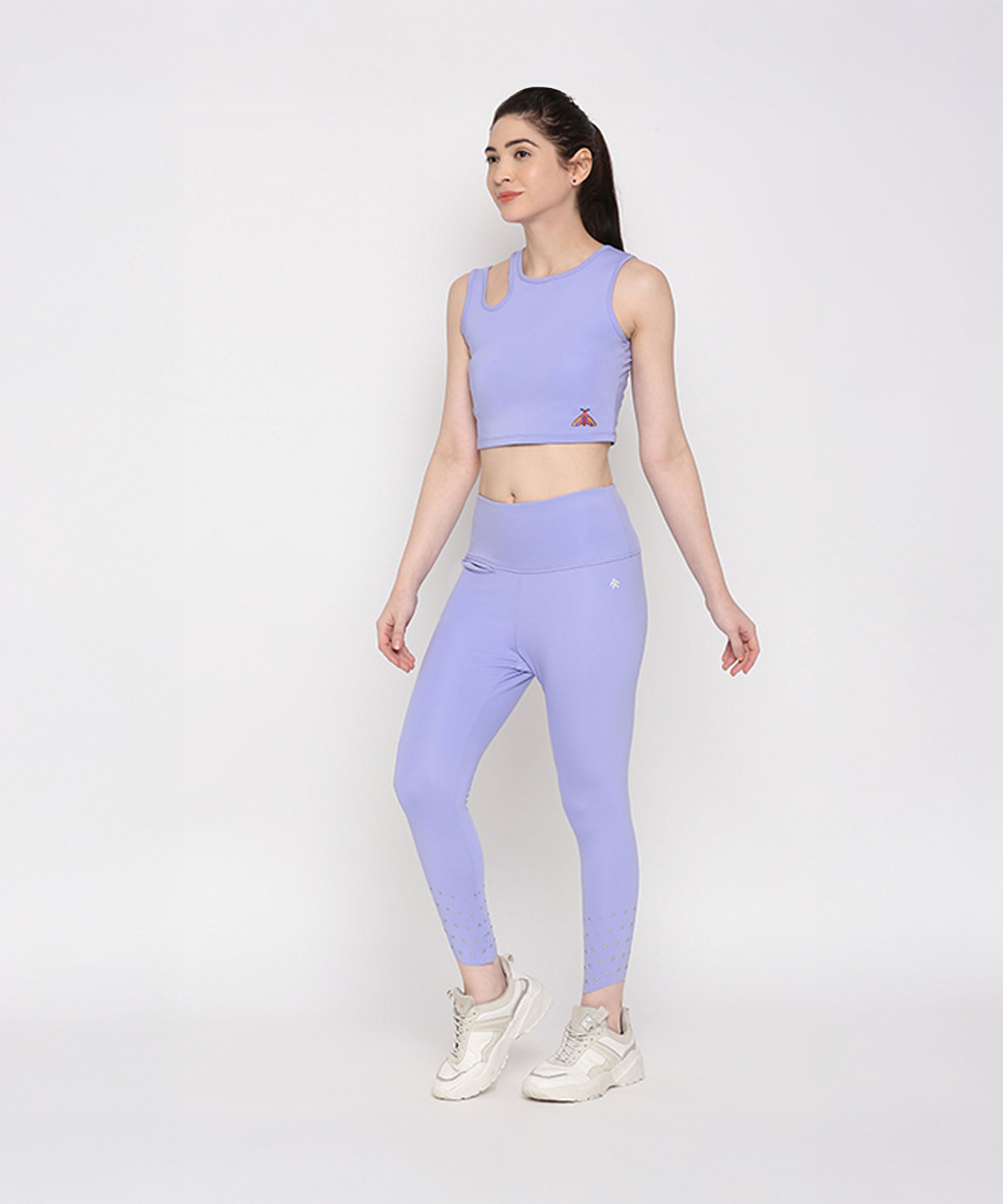Woman wearing the Tuna Active Lavender Co-ord Set with white sneakers, standing against a plain white background.