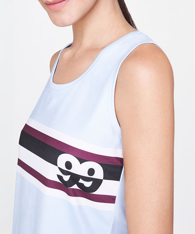 Woman wearing a relaxed fit Powder Blue T-Shirt featuring maroon and black stripes, sleeveless design, and an eyes graphic.