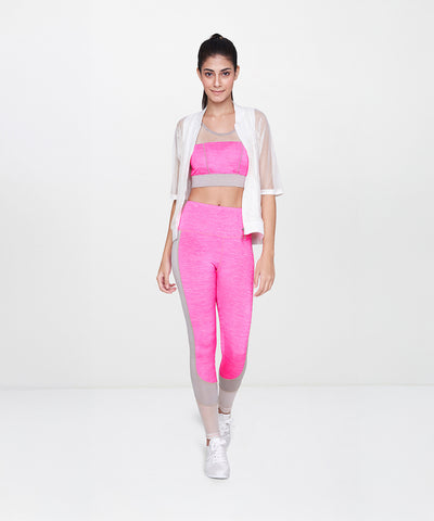 Woman in pink sportswear wears a White Sheer Jacket while walking forward against a plain white background.