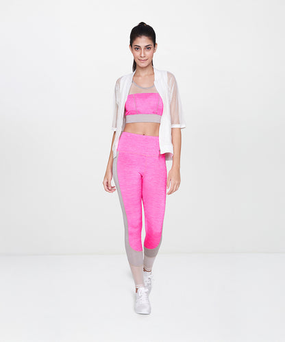 Woman in pink sportswear wears a White Sheer Jacket while walking forward against a plain white background.