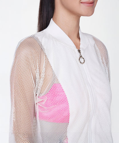 Woman wearing the White Sheer Jacket over a bright pink top, shown from the shoulders up.