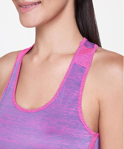 Smiling woman in a purple and pink racerback tank top, shown from shoulders to chin, highlighting the Pink Bra—perfect for showcasing stylish activewear and supportive sports bras.