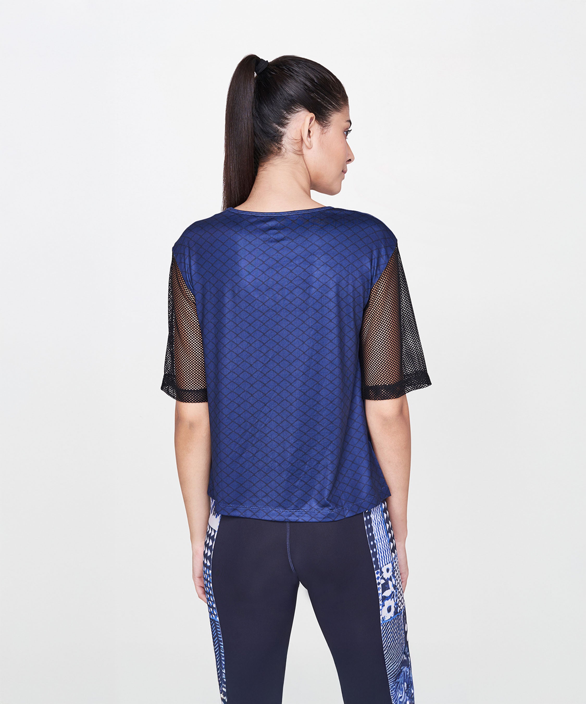 A woman in an Indigo Printed Top With Leggings.