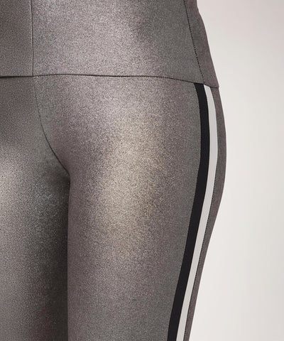 Close-up of High Waisted Metallic Leggings TLC116 in gray, featuring black and white side stripes.