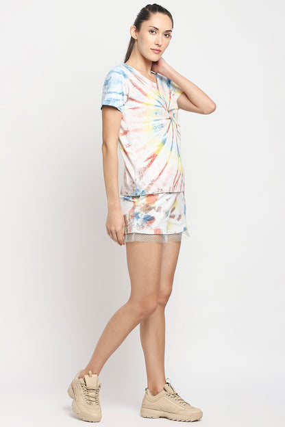 Woman wears Netted shorts + comfort tee, paired with beige sneakers, standing against a plain white background.