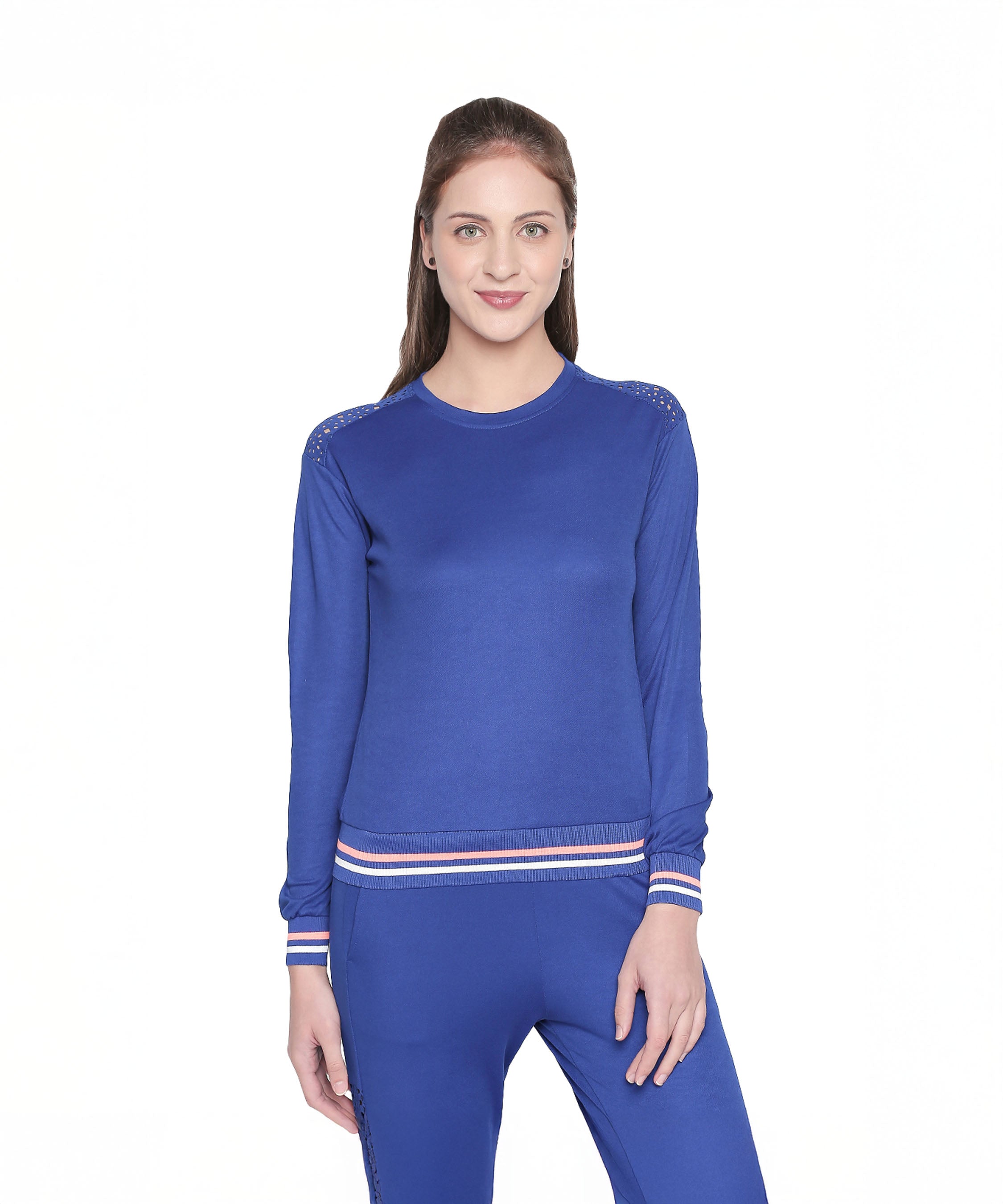 Woman in a Royal Blue Color Regular Fit Round Neck Full Sleeve Sweat Top with striped cuffs, smiling while standing against a white background.