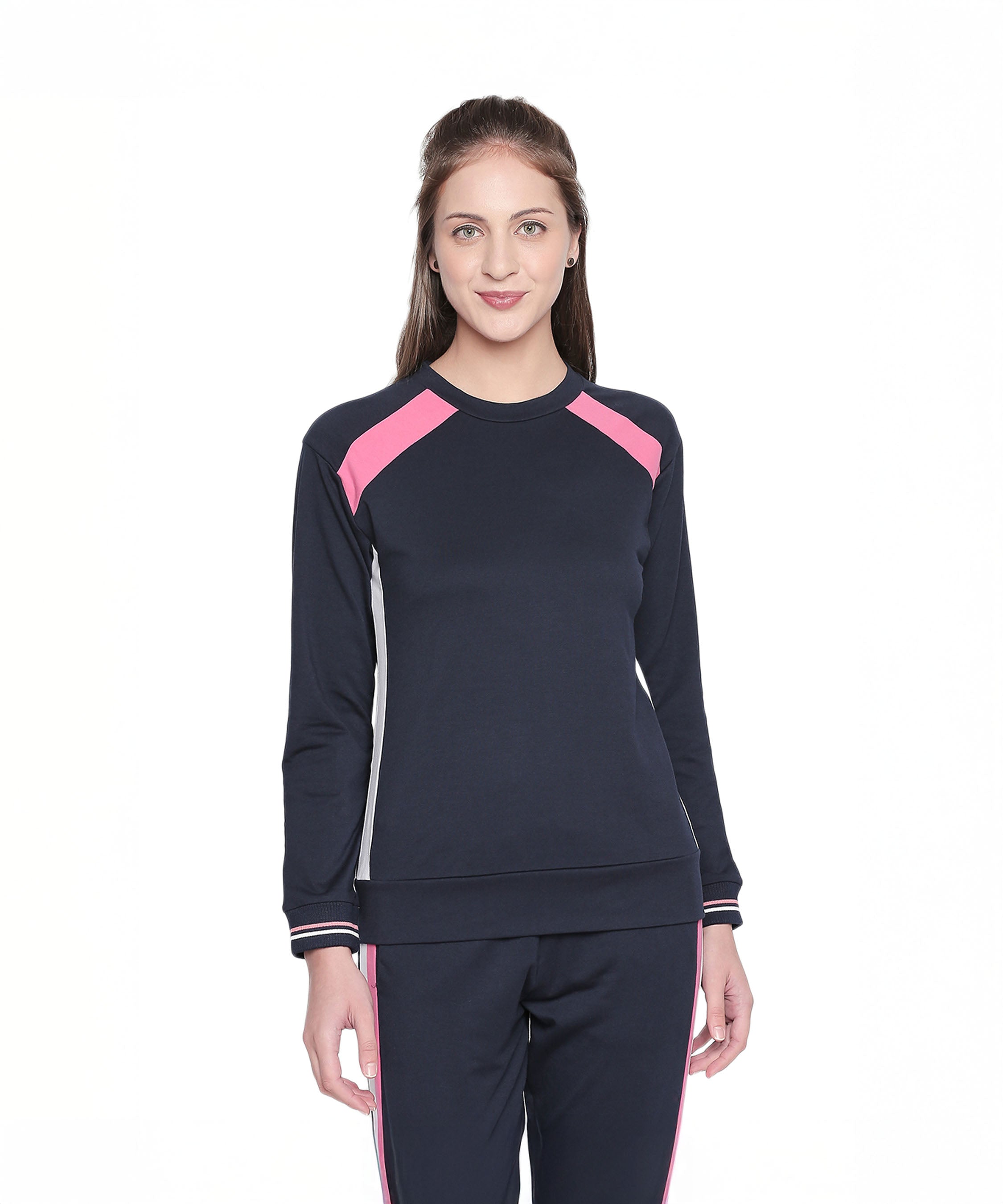 Woman wearing a stylish full sleeve Navy Blue round neck sweatshirt, standing and smiling against a white background.