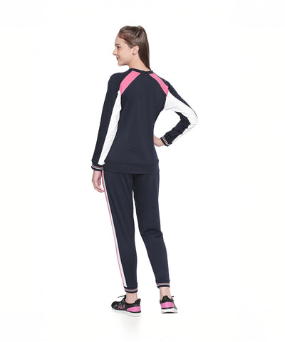 Woman models Navy Blue Joggers with Side Stripe, featuring navy, pink, and white details—stylish women’s activewear ideal for any sports activity.