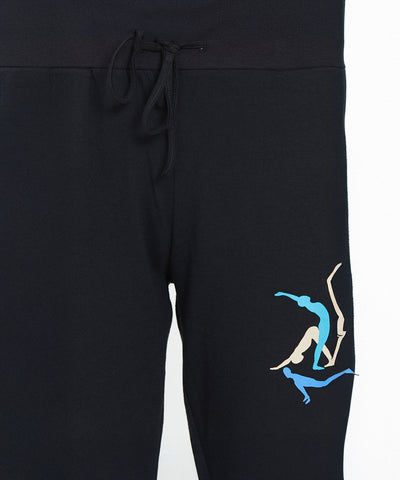 The Joggers - Ashtanga Series Black feature a drawstring and three blue and beige diver silhouettes near the left pocket, making them perfect for relaxed movement or Ashtanga yoga practice.