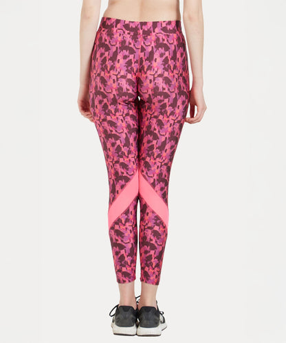 Model wears the Printed Slim Fit Track Pant LUSH with a high-rise waistband and black sneakers, shown from the back against a white background.