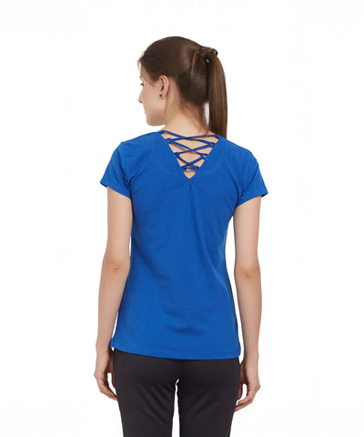 Woman in a Royal Blue Round Neck Tee from TUNA LONDON, featuring a crisscross back detail and crafted from soft cotton lycra, stands facing away from the camera.