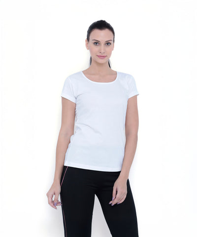 Woman wearing a TUNA LONDON White Round Neck Tee TLC45 and black pants stands against a plain white background, facing forward.