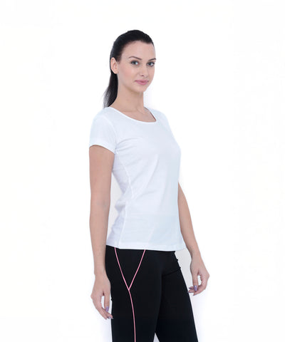 Woman wearing the TUNA LONDON White Round Neck Tee TLC45 and black pants with pink stripes, looking at the camera against a white background.