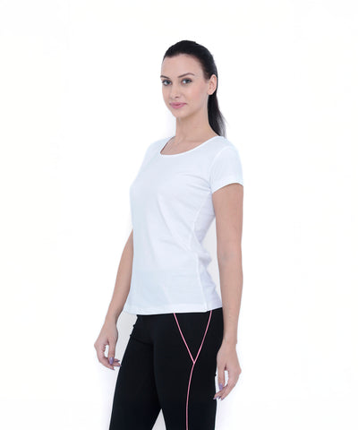 A woman in a TUNA LONDON White Round Neck Tee TLC45 and black pants with pink lines stands against a plain white background.