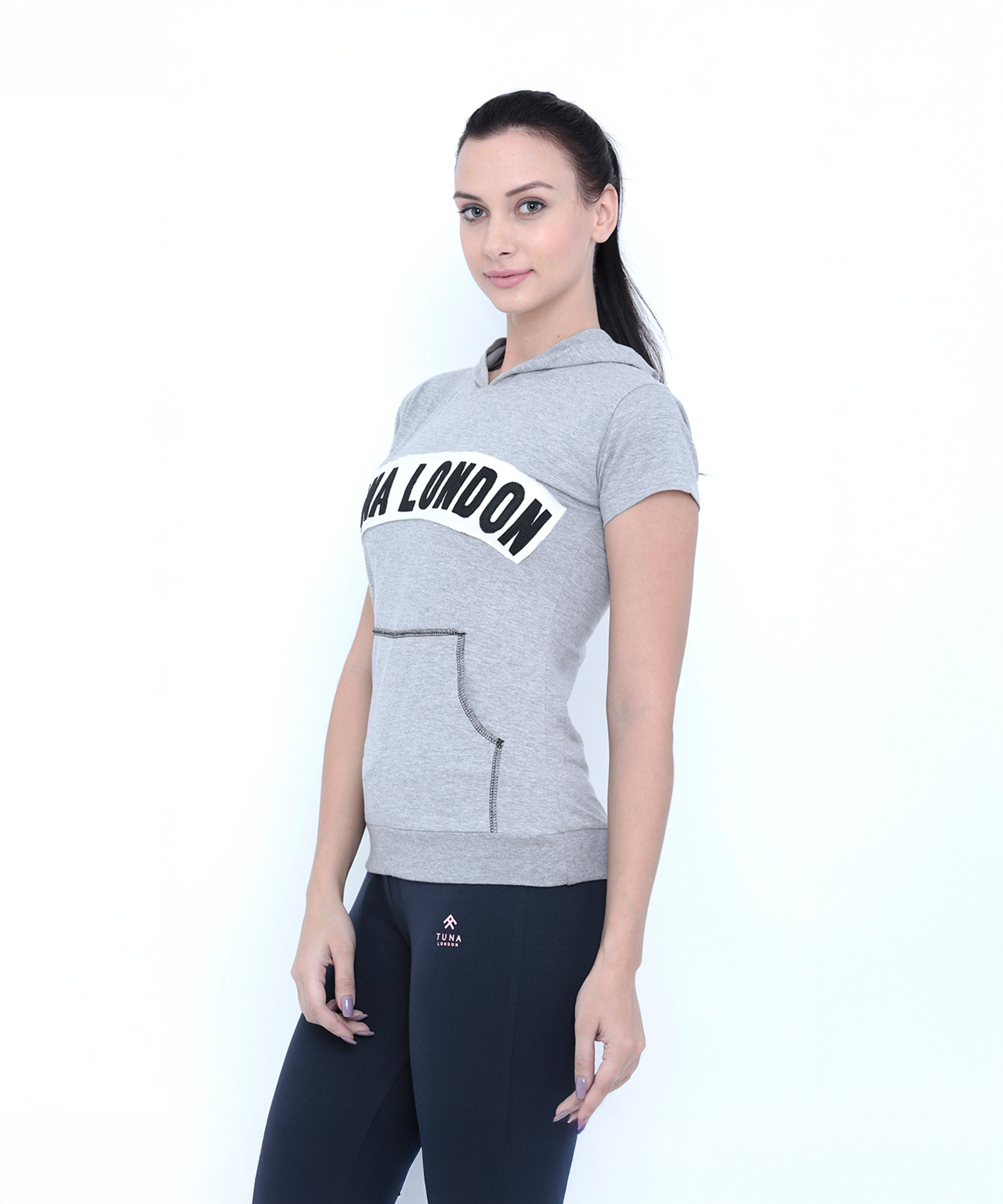 Fitness women will love this Grey Hoodie featuring "LTA LONDON" text, paired with black pants—a sporty yet casual look perfect for any occasion.