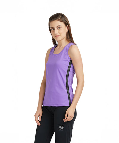 A woman wears a Purple round neck sleeveless top with moisture-wicking fabric and black pants, standing against a plain white background.