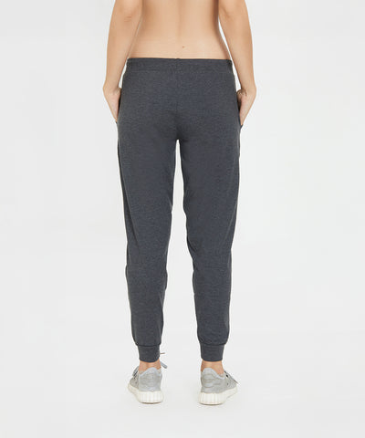 Model wears Classic Joggers 81 in a slim tapered fit with sneakers, viewed from the back against a plain white background.
